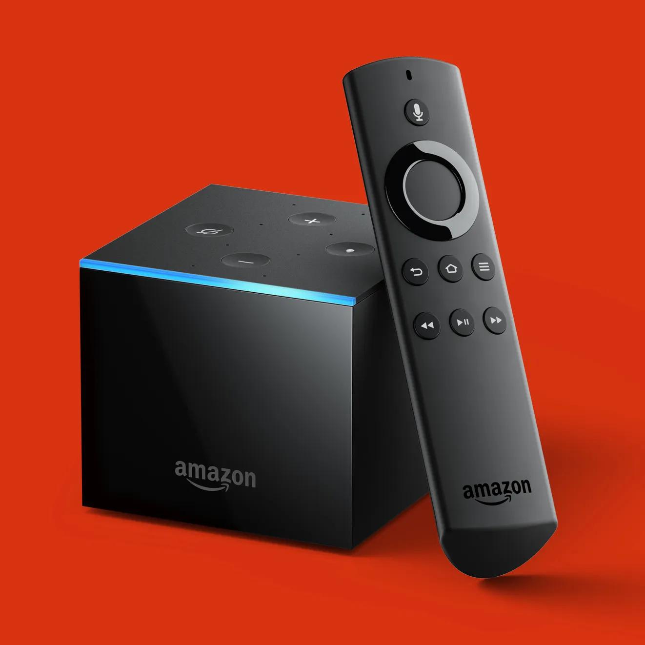 An Amazon Fire TV Cube standing beside its Alexa Voice Remote